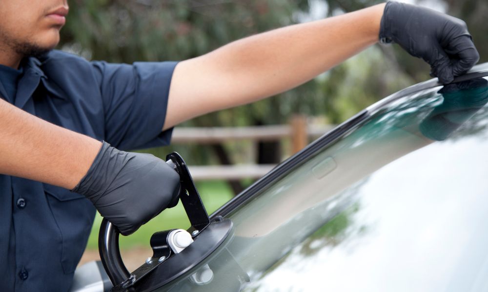Auto glass technician installing a windshield in Hampton Roads VA